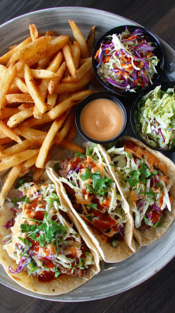 Smash burger tacos served with fries and slaw
