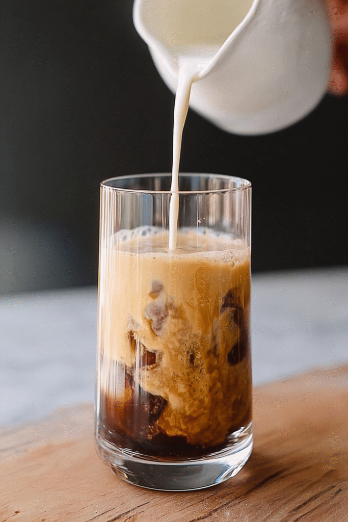 Frothing tahini espresso base in glass