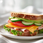 Knob sandwich on white ceramic plate with fresh halal ingredients