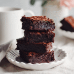 Sugar-free chocolate brownies on a white ceramic plate