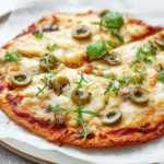 low carb pizza crust on white plate