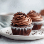 Chocolate keto cupcakes on white ceramic plate