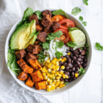 Sweet potato taco bowl with colorful toppings