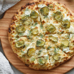 Dill pickle pizza recipe on wooden board